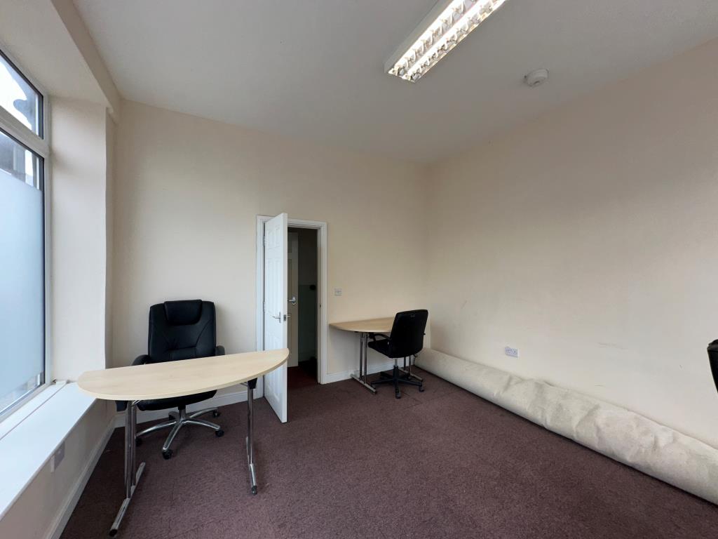 Lot: 104 - GROUND FLOOR OFFICE FOR INVESTMENT - internal view showing door to staff area and w.c.